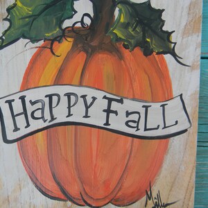 May include: A hand-painted wooden sign with a large orange pumpkin and a white banner that reads "Happy Fall".