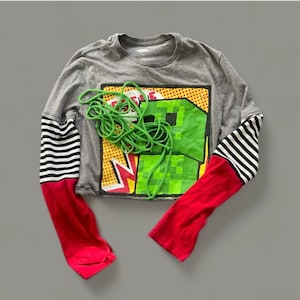 Upcycled Patchwork T-Shirt: Distressed Cold Shoulder Peplum Top - Size M