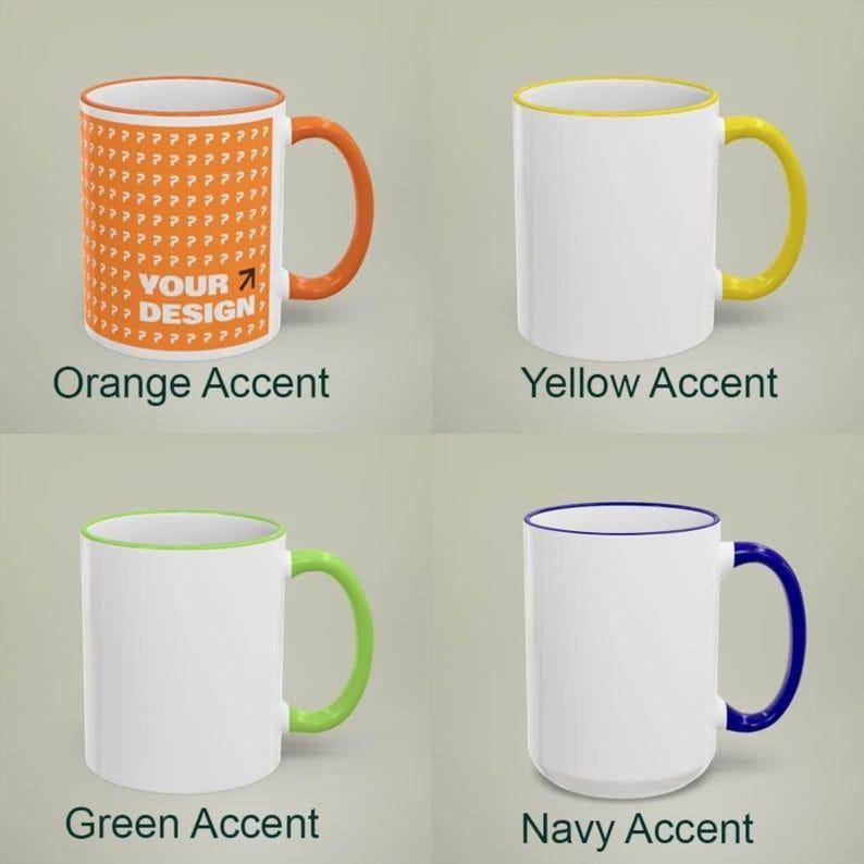 May include: Four white ceramic mugs with colored accents. One mug has an orange handle and interior, with a repeating pattern and the text "YOUR DESIGN". Other mugs have yellow, green, and navy blue accents.