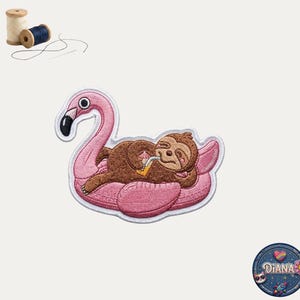 May include: An embroidered patch featuring a brown sloth relaxing on a pink flamingo pool float while holding a yellow drink with a straw. The patch has a white border. Included are two wooden spools of thread and a circular logo reading Diana.