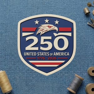 May include: A patriotic emblem with a shield shape, featuring a red, white, and blue color scheme. The design includes an eagle, stars, and the number "250" with the text "United States of America 1776-2026".