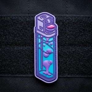 May include: A purple and blue patch in the shape of a lighter with a lava lamp design. The lighter has a purple outline, a blue body, and purple lava-like shapes inside. The background is black.