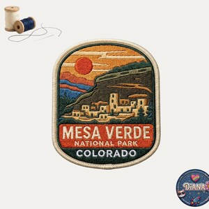 May include: An embroidered patch featuring a landscape of Mesa Verde National Park in Colorado, with a red sun, tan cliff dwellings, and blue mountains. The text reads MESA VERDE NATIONAL PARK COLORADO. Includes two spools of thread and a needle.