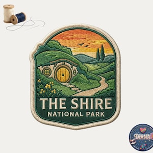 May include: Embroidered patch featuring a landscape with a hobbit hole, a winding path, and the text "THE SHIRE NATIONAL PARK." The patch has a green border and a sunset sky. Includes spools of thread.