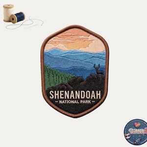 May include: A hexagonal embroidered patch featuring a landscape of Shenandoah National Park with a deer silhouette, blue mountains, green pine trees, and a sunset sky. The text reads SHENANDOAH NATIONAL PARK. Includes two spools of thread.