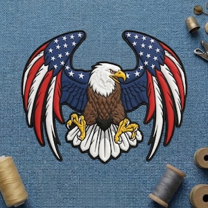 May include: Embroidered patch featuring a detailed American bald eagle with outstretched wings. The eagle has a white head, brown body, and yellow beak and talons. The wings display the American flag design with red and white stripes and blue stars.