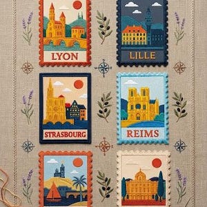 May include: A beige fabric sampler featuring six embroidered postage stamp designs of cities including Lyon, Lille, Strasbourg, Reims, Marseille, and Madrid. The embroidery includes colorful architectural landmarks, suns, and decorative lavender and olive sprigs.