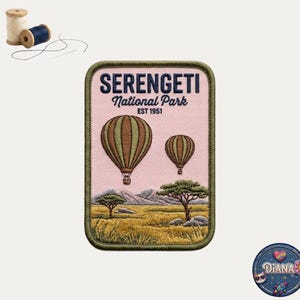 May include: A rectangular embroidered patch featuring a light pink background with two brown and green hot air balloons above a savanna landscape with trees and mountains. The text reads SERENGETI National Park EST 1951 in dark blue lettering.
