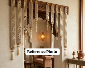 May include: A decorative wooden door frame with ornate carvings, adorned with hanging beaded garlands. The garlands feature mirrored accents and tassel details. A warm, inviting interior with a hanging lantern is visible.