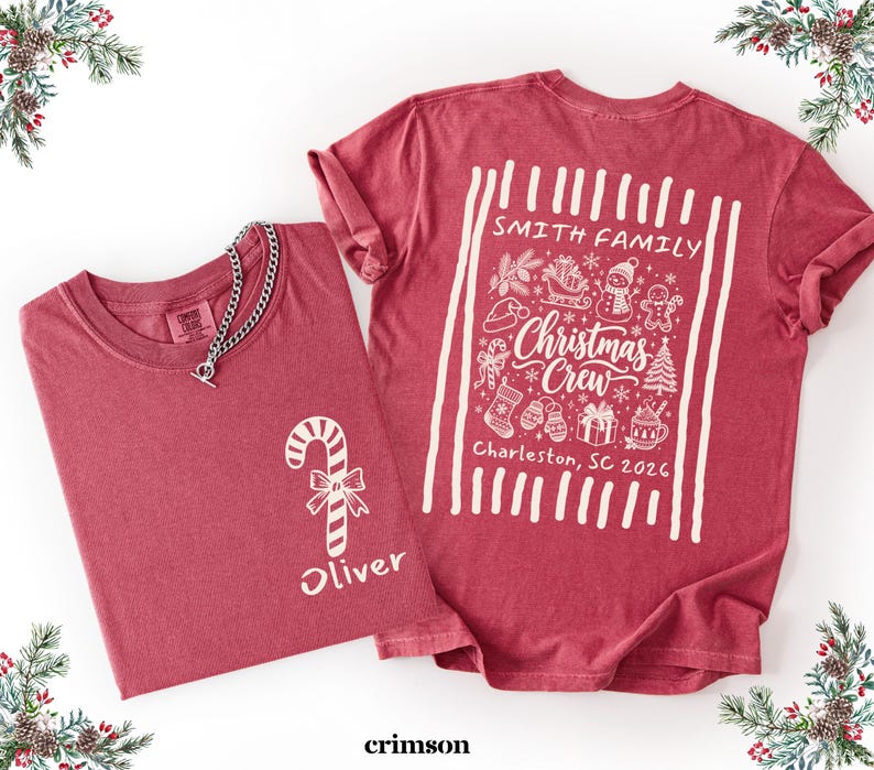 May include: A crimson red t-shirt featuring a white graphic of a candy cane and the name Oliver on the front. The back displays a white graphic with the text Smith Family, Christmas Crew, and Charleston, SC 2026, surrounded by holiday icons.