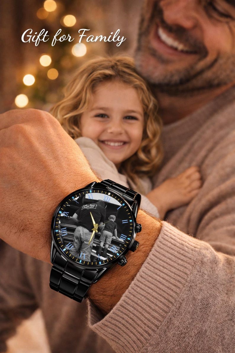 May include: Black wristwatch with a photo of a person and child on the watch face. The watch has a black band and a black face with gold hands. The text "Gift for Family" is at the top.