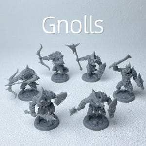 May include: A collection of gray miniature Gnoll figurines, each posed with weapons such as bows, axes, and swords. The figurines are on circular bases, and the word "Gnolls" is written in white across the top.