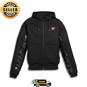 May include: Black zip-up hoodie with a hood and a small red logo on the chest. The sleeves feature the word "DUCATI" in a repeating pattern. The hoodie has a "Trusted Seller" badge and a "Free Shipping" graphic.