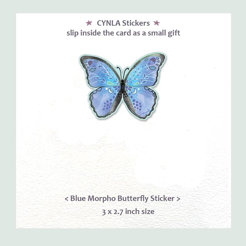 May include: A blue butterfly sticker with intricate white floral and crescent moon patterns on its wings. The text reads CYNLA Stickers, slip inside the card as a small gift, and Blue Morpho Butterfly Sticker, 3 x 2.7 inch size.