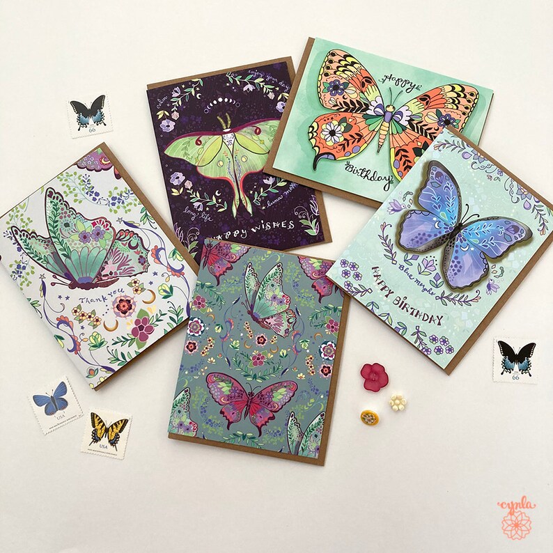 Butterfly thank you card flower insect art by Cindy LaColla ©cynla: Five greeting cards with butterfly designs. The cards have different colors and patterns, including purple, green, blue, and orange. The cards have different messages, including "Happy Birthday", "Thank You", and "Happy Wishes".