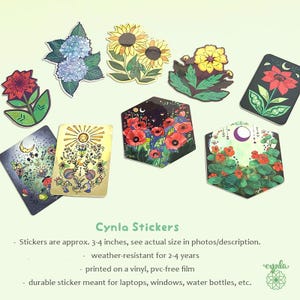 May include: A collection of nine decorative vinyl stickers featuring various floral and celestial illustrations, including sunflowers, hydrangeas, poppies, and sun and moon motifs in rectangular, hexagonal, and die-cut shapes with vibrant colors.