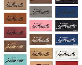 May include: A collage of 15 different color and material samples of laserable leatherette. Each sample has the text "Laserable Leatherette" printed on it in black text. The samples include colors like light brown, dark brown, gray, pink, red, blue, teal, white, and black. The materials include leatherette, cork, bamboo, and marble.