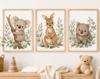 May include: Three framed watercolour prints showcasing Australian wildlife. The prints feature a koala on a branch, a kangaroo with its joey, and a koala surrounded by foliage. The artwork uses a soft, pastel colour palette.