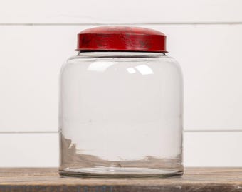 Frasco de vidrio transparente de 8" con tapa roja