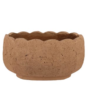 May include: A round, terracotta-colored ceramic bowl with a scalloped rim. The bowl has a textured surface and a slightly raised base. This decorative bowl is suitable for plants or as a decorative accent.