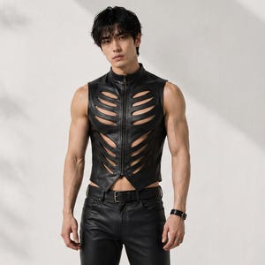 May include: A black sleeveless vest featuring a high collar, a central front zip, and symmetrical rib-like cutouts across the chest and torso. The garment is constructed from a smooth material and is paired with matching black trousers.