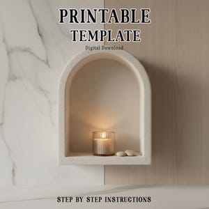 May include: A beige alcove with a lit candle in a glass holder, two small stones, and the text "PRINTABLE TEMPLATE" and "STEP BY STEP INSTRUCTIONS". The alcove is set against a marble and wood-panelled wall.