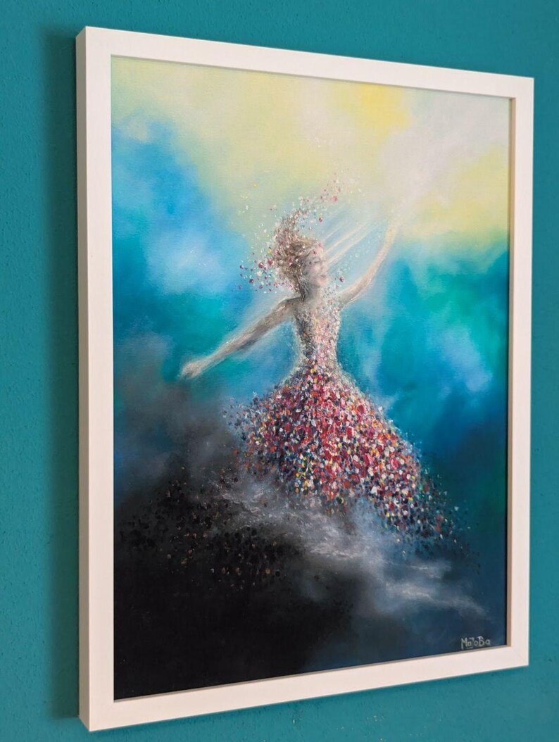 May include: A framed painting depicting a figure in a dress composed of colorful, scattered petals or confetti, reaching toward a bright yellow light. The background transitions from deep black at the bottom to vibrant blue and teal hues.