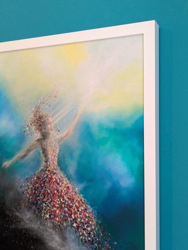 May include: A framed painting featuring a figure composed of colorful, scattered paint flecks against a vibrant blue and yellow background. The figure appears to be in motion, with particles trailing from the body into a bright, light-filled area.
