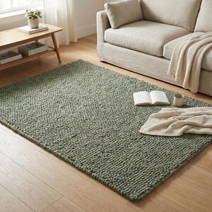 Edge detail of thick loop pile rug revealing woven backing