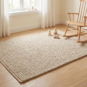 Soft neutral textured rug styled for cozy bedroom or living room décor