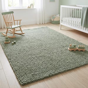 Cozy minimalist green rug styled in calm natural light interior