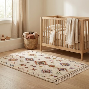 Soft Moroccan wool rug styled in a nursery room, showcasing cozy texture, neutral ivory tones, and child-friendly plush surface