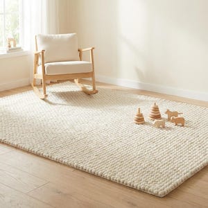 Cozy bedroom-style setting with plush ivory textured wool area rug