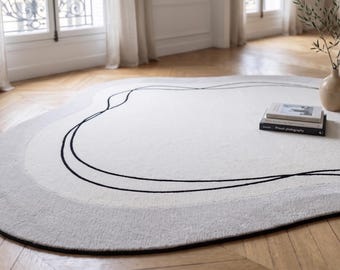 Tappeto astratto organico, tappeto scandinavo beige neutro, arredamento moderno per il soggiorno.