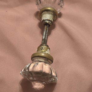 May include: A set of three ceramic mugs with a speckled, matte finish. Each mug features a different color: light blue, cream, and gray. The mugs have a simple, modern design and a comfortable handle.