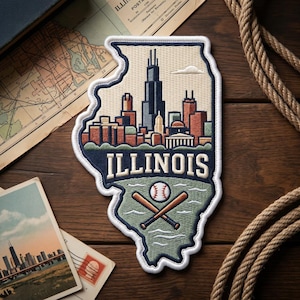 May include: Embroidered patch in the shape of Illinois, featuring a skyline, the word "ILLINOIS", a baseball, and crossed bats. The patch has a white border and is set against a wooden background.