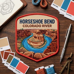 May include: A shield-shaped embroidered patch featuring a landscape of Horseshoe Bend and the Colorado River. The patch has a red border, tan sky, and blue river winding through brown rock formations. The text reads HORSESHOE BEND COLORADO RIVER.