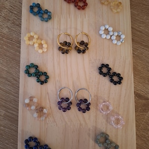 May include: A set of three ceramic mugs with a speckled, matte finish. The mugs are in shades of cream, light gray, and dark gray. Each mug has a simple, minimalist design, perfect for coffee or tea.