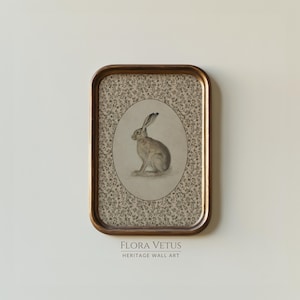 Hare printable in an oval antique frame with floral patterned background.