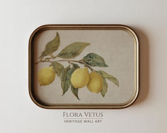 May include: A rectangular wall art piece with rounded corners in a gold frame, featuring a botanical illustration of three yellow lemons on a branch with green leaves against a beige background. The text FLORA VETUS HERITAGE WALL ART is below.