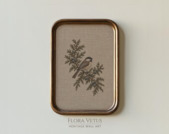 May include: A rectangular wall art piece in a bronze-toned frame featuring a beige linen background with a detailed illustration of a small bird perched on a coniferous branch with berries. The text FLORA VETUS HERITAGE WALL ART is below.