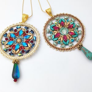 May include: Two gold necklaces with round beaded pendants featuring colorful crystal and glass bead designs. The pendants are attached to teardrop-shaped beads.