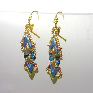 May include: A pair of gold dangle earrings with blue, green, and gold beads. The earrings are shaped like a chevron and have a gold hook closure.