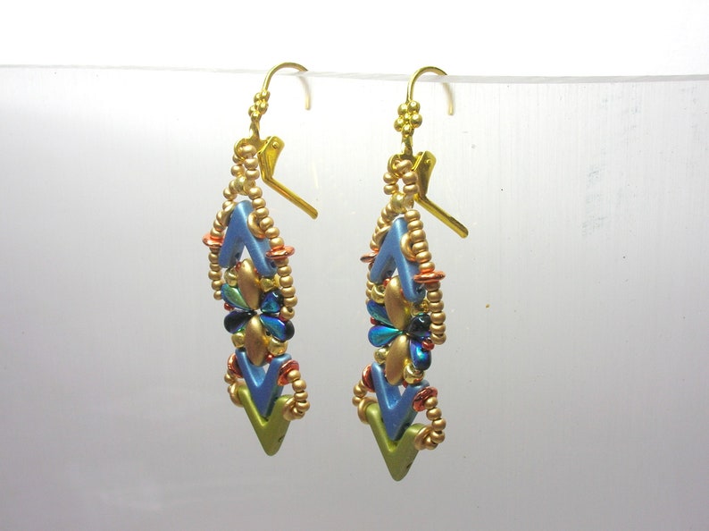 May include: A pair of gold dangle earrings with blue, green, and gold beads. The earrings are shaped like a chevron and have a gold hook closure.