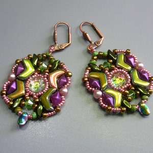 May include: A pair of earrings with a geometric design featuring green, pink, and gold beads. The earrings have a copper hook closure.