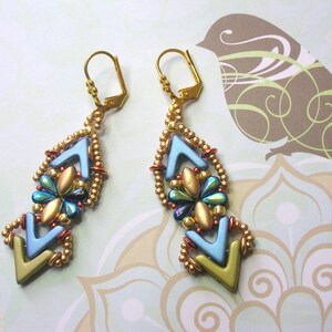 May include: A pair of gold earrings with blue, green, and gold beads in a geometric pattern.