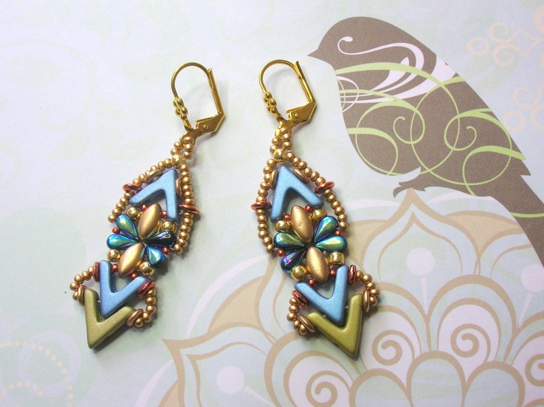 May include: A pair of gold earrings with blue, green, and gold beads in a geometric pattern.