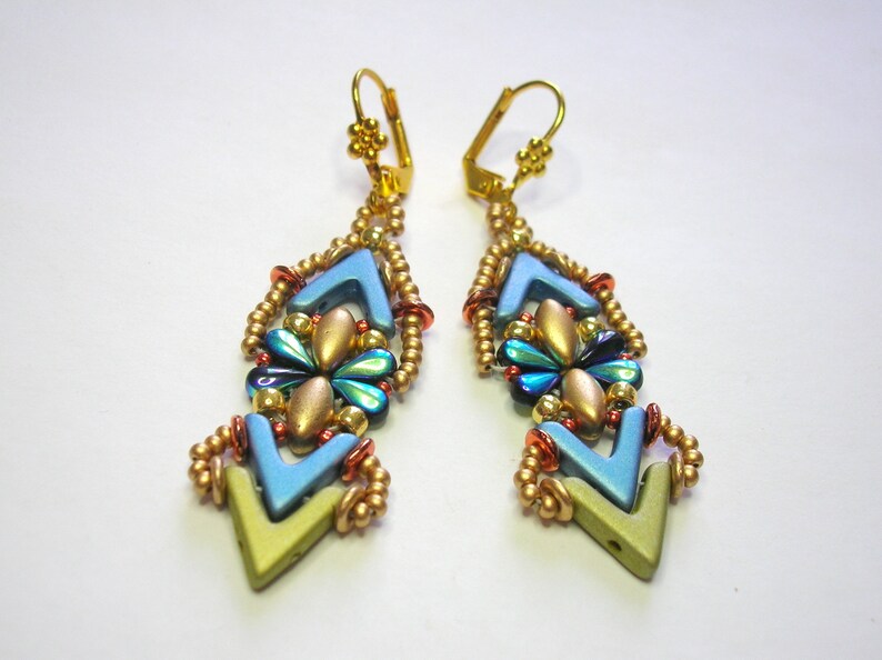 May include: A pair of gold dangle earrings with blue, green, and gold beads. The earrings are shaped like a diamond with a pointed bottom.