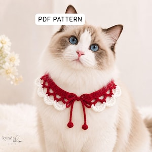 May include: A Ragdoll cat wearing a red and white crocheted collar with a bow and two small red pom-poms. The collar has a scalloped edge. The text "PDF PATTERN" is in the top left corner.
