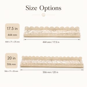 May include: Two decorative wall shelves with scalloped edges. One shelf is 17.5 inches (444 mm) long, and the other is 20 inches (506 mm) long. The shelves are a light, pearlescent color and have dimensions noted in inches and millimeters.